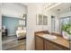 The main bedroom featuring an ensuite bathroom with modern fixtures and finishes at 1821 Christina Lee Ln, St Cloud, FL 34769