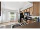 Kitchen with wood cabinets and black appliances at 1821 Christina Lee Ln, St Cloud, FL 34769