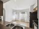 Bright kitchen nook with tiled flooring and natural light from the large windows at 1821 Christina Lee Ln, St Cloud, FL 34769