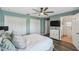 Bright main bedroom featuring closet space, an ensuite bathroom, a ceiling fan, and nice flooring at 1821 Christina Lee Ln, St Cloud, FL 34769