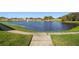 Beautiful pond with fountain feature, lush green surroundings, and walking path at 1821 Christina Lee Ln, St Cloud, FL 34769