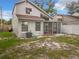 Exterior backyard view showing the home's screened porch and surrounding yard space at 1970 Larkwood Dr, Apopka, FL 32703