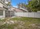 Fenced backyard with a screened-in porch area, offering privacy and outdoor enjoyment at 1970 Larkwood Dr, Apopka, FL 32703