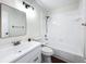 A well-lit bathroom featuring a combined tub and shower, framed mirror and vanity with sink at 1970 Larkwood Dr, Apopka, FL 32703