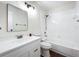 A well-lit bathroom featuring a combined tub and shower, framed mirror and vanity with sink at 1970 Larkwood Dr, Apopka, FL 32703