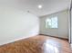 An empty bedroom featuring hardwood floors, a window and neutral paint at 1970 Larkwood Dr, Apopka, FL 32703