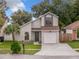 Charming two-story home features a well-maintained lawn and inviting front entrance at 1970 Larkwood Dr, Apopka, FL 32703