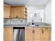 Kitchen featuring stainless steel appliances, light wood cabinets, granite countertops, and backsplash at 1970 Larkwood Dr, Apopka, FL 32703