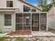 Exterior view of the rear enclosed porch, connecting to the home and backyard space at 1970 Larkwood Dr, Apopka, FL 32703