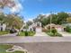 Street view of home featuring a well-manicured lawn, driveway, and mature landscaping at 1970 Larkwood Dr, Apopka, FL 32703