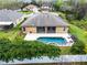 This aerial view highlights the private backyard pool, screened in patio, and fenced in yard at 2137 Blackjack Oak St, Ocoee, FL 34761