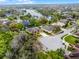 Aerial view of single Gathering homes with large lake and mature landscaping in a residential neighborhood at 2137 Blackjack Oak St, Ocoee, FL 34761