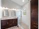 Modern bathroom features a double vanity, walk-in shower, and stylish fixtures at 2137 Blackjack Oak St, Ocoee, FL 34761