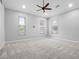 Spacious bedroom with three windows and neutral carpet at 2137 Blackjack Oak St, Ocoee, FL 34761