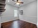 This bedroom showcases hardwood floors, trim detail, a ceiling fan, and a window at 2137 Blackjack Oak St, Ocoee, FL 34761