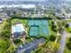 Aerial view of community pool, playground, and tennis and basketball courts near a lake at 2137 Blackjack Oak St, Ocoee, FL 34761