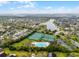 Aerial view of community pool, playground, and tennis and basketball courts near a lake at 2137 Blackjack Oak St, Ocoee, FL 34761