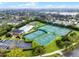 Aerial view of community pool, playground, and tennis and basketball courts near a lake at 2137 Blackjack Oak St, Ocoee, FL 34761