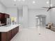 Open-concept living area showcases a modern kitchen with stainless steel appliances and a comfortable living space at 2137 Blackjack Oak St, Ocoee, FL 34761