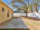 Spacious backyard featuring a cement patio and privacy fence at 2339 Foxtree Rd, Tavares, FL 32778