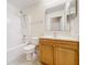 Bathroom featuring a single vanity, toilet, and shower-tub combo at 2339 Foxtree Rd, Tavares, FL 32778