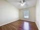 Bedroom with wood floors and neutral paint at 2339 Foxtree Rd, Tavares, FL 32778