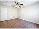 Bedroom with ceiling fan, neutral walls and wood flooring at 2339 Foxtree Rd, Tavares, FL 32778