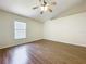 Bedroom with wood floors, neutral paint and vaulted ceilings at 2339 Foxtree Rd, Tavares, FL 32778