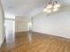 Bright living room with a contemporary chandelier and neutral walls creating an airy space at 2339 Foxtree Rd, Tavares, FL 32778