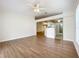 Bright and airy living room with a ceiling fan and seamless flow into the adjacent kitchen area at 2339 Foxtree Rd, Tavares, FL 32778