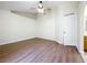 Main bedroom boasting a ceiling fan, vaulted ceiling and entrance to main bathroom at 2339 Foxtree Rd, Tavares, FL 32778