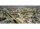 This aerial view shows the neighborhood homes next to a large drainage canal and recreational field at 2413 Spingarn Ct, Orlando, FL 32811