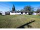 Spacious backyard with green grass and an additional shed providing outdoor storage at 2413 Spingarn Ct, Orlando, FL 32811