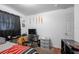 Bedroom featuring a television and a desk at 2413 Spingarn Ct, Orlando, FL 32811