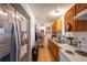 Functional kitchen featuring ample counter space, wooden cabinetry, and modern appliances at 2413 Spingarn Ct, Orlando, FL 32811