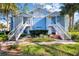 Two story blue condos with white stairways and landscaped front yard at 2508 Grassy Point Dr # 106, Lake Mary, FL 32746