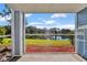 Relaxing screened patio offers tranquil lake views and outdoor enjoyment at 2508 Grassy Point Dr # 106, Lake Mary, FL 32746