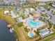 A stunning aerial view showcasing the community's luxurious amenities, including multiple pools, a lazy river, and a splash pad at 2839 Bookmark Dr, Kissimmee, FL 34746