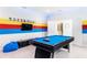 Inviting game room featuring a pool table, bean bag, and flat screen tv; perfect for entertaining guests and Gathering at 2839 Bookmark Dr, Kissimmee, FL 34746