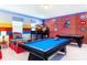 Spacious game room features a pool table, bunk beds, and fun 'Superhero' decor at 2839 Bookmark Dr, Kissimmee, FL 34746