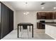 Dining area featuring a table with seating next to the modern kitchen at 301 E Fiesta Key Loop, Deland, FL 32720