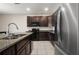 Kitchen area showcasing granite countertops and stainless steel refrigerator at 301 E Fiesta Key Loop, Deland, FL 32720