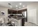 Modern kitchen with granite island, stainless steel appliances, and ample cabinet space, perfect for cooking at 301 E Fiesta Key Loop, Deland, FL 32720