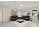 Comfortable living room featuring dual sofas, chic decor, and a bright atmosphere, ideal for relaxation at 301 E Fiesta Key Loop, Deland, FL 32720