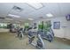 Well-equipped gym features a range of cardio machines, weights, and mirrors, providing a comprehensive fitness experience at 3021 Red Ginger Rd, Kissimmee, FL 34747