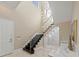 Hallway with glass staircase, modern chandelier, and a glass-enclosed wine cellar at 3037 Seigneury Dr, Windermere, FL 34786