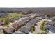 Aerial view of a well-maintained neighborhood featuring diverse home designs and green landscapes, creating a serene setting at 3202 Condrey Ct, The Villages, FL 32163