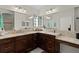 Bathroom featuring double sinks, granite countertops, and stylish lighting at 3202 Condrey Ct, The Villages, FL 32163