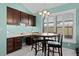 Bright kitchen nook with a breakfast table and large windows at 3202 Condrey Ct, The Villages, FL 32163