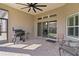 Outdoor patio featuring brick flooring, a BBQ and a ceiling fan at 3202 Condrey Ct, The Villages, FL 32163